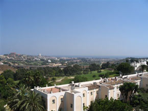 View of golf course and sea
